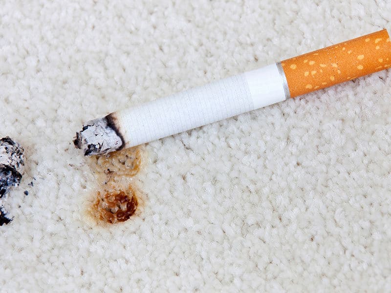 Burning Cigarette on Carpet