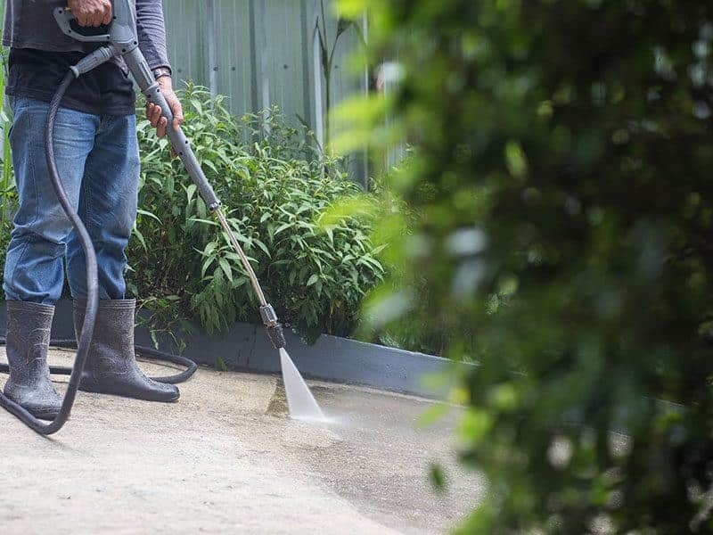 Man Clean Concrete Floors